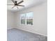Bedroom with ceiling fan and two windows at 2707 Crescent Ln, Gastonia, NC 28052