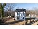Rear view of two story house with white siding and sliding glass door at 2707 Crescent Ln, Gastonia, NC 28052