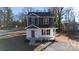 Two-story house with gray and white siding, red door, and small porch at 2707 Crescent Ln, Gastonia, NC 28052