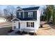 Two-story house with gray and white siding, red door, and small porch at 2707 Crescent Ln, Gastonia, NC 28052