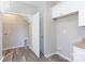 Laundry room with upper cabinets and built-in shelving at 2707 Crescent Ln, Gastonia, NC 28052