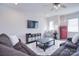 Bonus room with sectional sofa, red refrigerator, and plenty of natural light at 5911 Mantle Way, Kannapolis, NC 28081