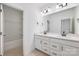 Bathroom with double vanity, quartz countertop, and a shower/tub combo at 1190 Lost Cove Rd, Indian Land, SC 29707