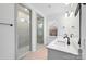 Bathroom with double vanity, walk-in shower, and gray tile at 1190 Lost Cove Rd, Indian Land, SC 29707