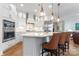 Modern kitchen with white cabinets, quartz countertops, and stainless steel appliances at 1353 Millview Ln, Matthews, NC 28104