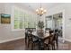 Cozy dining room featuring a wooden table with seating for six, plantation shutters and hardwood floors at 4028 Brandywine Ter, Lancaster, SC 29720