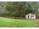 Small shed in a wooded backyard setting at 2178 Eastview Rd, Rock Hill, SC 29732