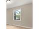 Simple bedroom with a large window and neutral walls at 2178 Eastview Rd, Rock Hill, SC 29732