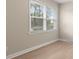 Bright bedroom with hardwood floors and two large windows at 2178 Eastview Rd, Rock Hill, SC 29732