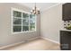 Bright dining room featuring a large window and chandelier at 2178 Eastview Rd, Rock Hill, SC 29732