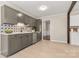 Updated kitchen with gray cabinets, white quartz countertops and tile backsplash at 2178 Eastview Rd, Rock Hill, SC 29732