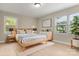 Light and airy main bedroom with a wooden bed frame at 2178 Eastview Rd, Rock Hill, SC 29732