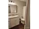 Updated bathroom with granite top vanity, dark framed mirror, and tub and shower combination at 513 Mary Charlotte Dr, Charlotte, NC 28262