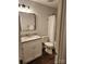 Bathroom featuring granite top vanity, dark framed mirror, and tub and shower combination at 513 Mary Charlotte Dr, Charlotte, NC 28262