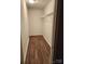 Small, walk-in closet with wire shelves and wood-look flooring at 513 Mary Charlotte Dr, Charlotte, NC 28262