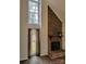 Cozy living room featuring a brick fireplace, large windows, and wood-look flooring at 513 Mary Charlotte Dr, Charlotte, NC 28262