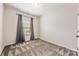 Simple bedroom with neutral wall colors and carpet flooring at 9714 Ainslie Downs St, Charlotte, NC 28273