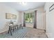 Bright home office with a desk, window, and neutral wall colors at 9714 Ainslie Downs St, Charlotte, NC 28273