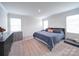 Bright bedroom with king-size bed and plush carpeting at 102 Guardian Gate Dr, Mooresville, NC 28115