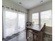 Dining area with wooden table and chairs, and sheer curtains at 102 Guardian Gate Dr, Mooresville, NC 28115