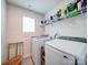 Laundry room with washer, dryer, and shelving at 102 Guardian Gate Dr, Mooresville, NC 28115