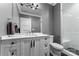 Modern bathroom with white vanity, marble countertop, and a glass shower at 3645 Pelham Ln, Charlotte, NC 28211