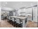 Modern kitchen with white cabinets, large island, and stainless steel appliances at 3645 Pelham Ln, Charlotte, NC 28211