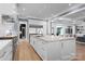 Sleek kitchen with white cabinetry, marble countertops, and stainless steel appliances at 3645 Pelham Ln, Charlotte, NC 28211