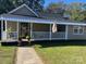 Charming exterior with covered porch and well-manicured lawn at 317 Annafrel St, Rock Hill, SC 29730