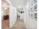 Light-filled hallway featuring hardwood floors and access to multiple rooms at 317 Annafrel St, Rock Hill, SC 29730