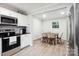 Modern kitchen with stainless steel appliances, breakfast area, and light-filled window at 317 Annafrel St, Rock Hill, SC 29730