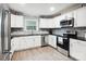 Modern kitchen with stainless steel appliances, white cabinets and granite countertops at 317 Annafrel St, Rock Hill, SC 29730