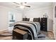 Bright main bedroom with ceiling fan, adjacent sitting room, and black accent furniture at 317 Annafrel St, Rock Hill, SC 29730