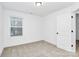 Bright bedroom with window and neutral walls at 577 Westside Cir, China Grove, NC 28023