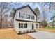 Two-story house with gray and white siding, front porch, and driveway at 577 Westside Cir, China Grove, NC 28023