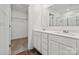 Bathroom with double vanity, walk-in shower, and closet at 731 Olde England Dr, Lincolnton, NC 28092