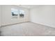 Bright bedroom with neutral carpet and large windows at 731 Olde England Dr, Lincolnton, NC 28092