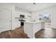 Modern kitchen with white cabinets, stainless steel appliances, and island at 731 Olde England Dr, Lincolnton, NC 28092