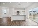 Modern kitchen with white cabinets, stainless steel appliances, and island at 731 Olde England Dr, Lincolnton, NC 28092