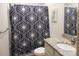 Bathroom with granite countertop, a shower/tub combo, and patterned shower curtain at 1109 Creedmore Ct, Charlotte, NC 28215