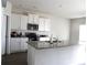 Modern kitchen with white cabinets, granite countertops, and stainless steel appliances at 1109 Creedmore Ct, Charlotte, NC 28215