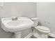 This bathroom is equipped with white fixtures and new flooring at 1725 Feature Rd, Lancaster, SC 29720