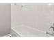 Bathroom features a white tub with tiled walls and chrome hardware for a clean, modern look at 1725 Feature Rd, Lancaster, SC 29720