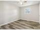 Bedroom with updated flooring and lighting offers a bright window at 1725 Feature Rd, Lancaster, SC 29720
