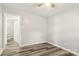 Cozy bedroom with neutral paint and updated laminate flooring throughout the living space at 1725 Feature Rd, Lancaster, SC 29720