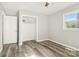 Bright bedroom with a ceiling fan, spacious closet and large windows to provide natural light at 1725 Feature Rd, Lancaster, SC 29720
