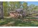 Brick home with a screened-in porch and convenient carport, set in a well-maintained, grassy yard at 1725 Feature Rd, Lancaster, SC 29720