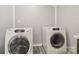 Laundry area featuring a modern side-by-side washer and dryer set with a clean, organized space at 1725 Feature Rd, Lancaster, SC 29720