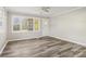 The living room area is naturally lit with a charming front door at 1725 Feature Rd, Lancaster, SC 29720