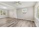 Inviting living room with fresh paint, new laminate floors, and bright natural lighting at 1725 Feature Rd, Lancaster, SC 29720